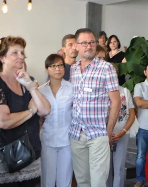 a group of people standing in a room